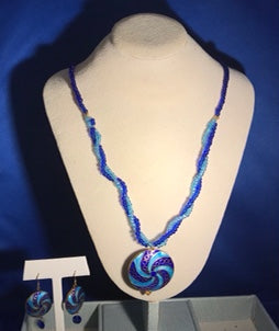 Cloisonné (light blue & royal blue spiral) necklace with antique Czech glass Mardi Gras beads and matching earrings